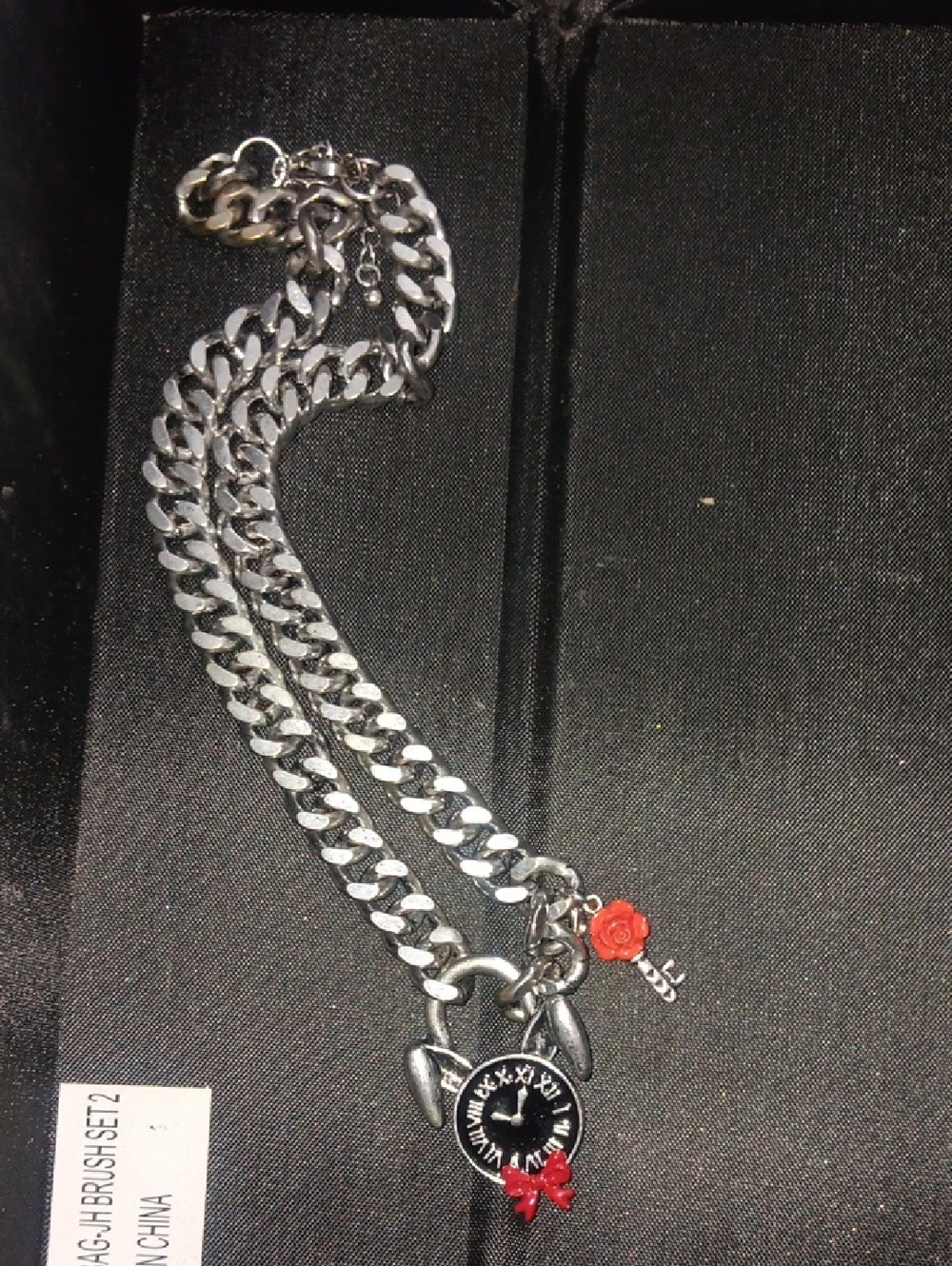 Silver Tone Charm Chain Necklace with Black Dial Pendant and Red Accents